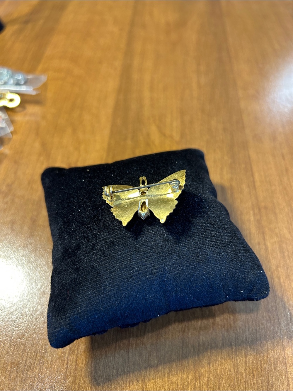 Elegant Butterfly Pendant with Red Gemstone Accent - Picture 3 of 3